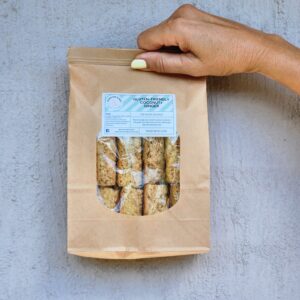 Hand holding a 500gm bacg of rusks